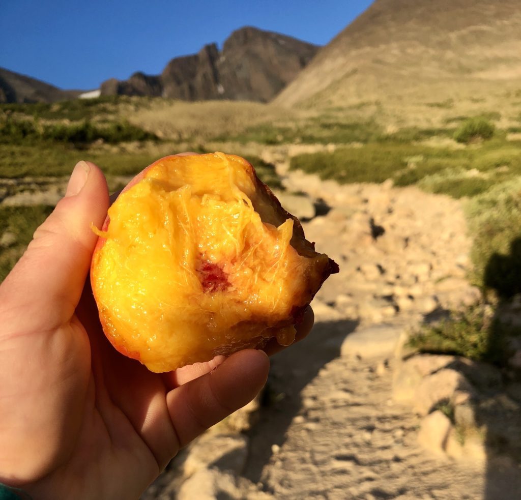 erin demarco savoring an in season colorado peach