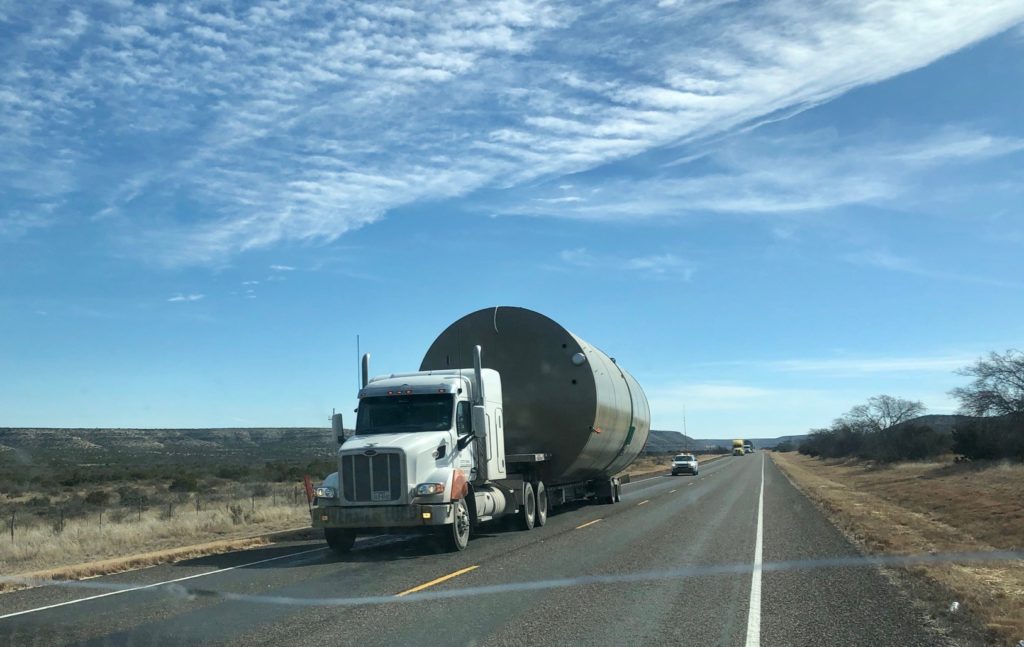 oil rig truck along US 285 highway death highway texas boomtown podcast